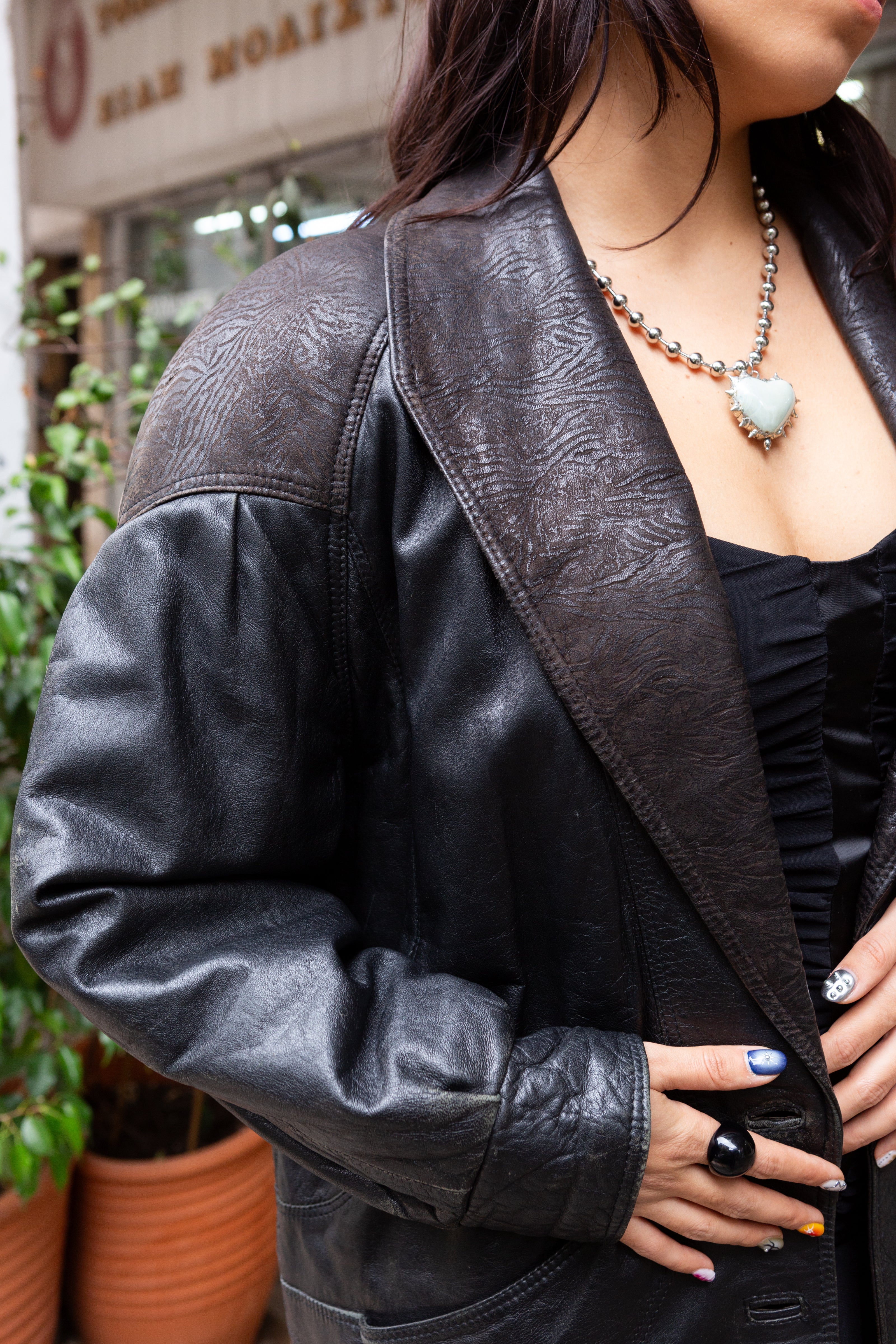 Stunning 80s leather jacket with patterned leather details and shoulder pads