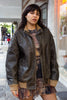 Super cool distressed brown leather jacket with knitted details (L)