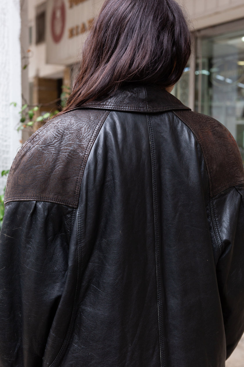 Stunning 80s leather jacket with patterned leather details and shoulder pads