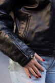 Woman’s vintage black leather jacket (M)