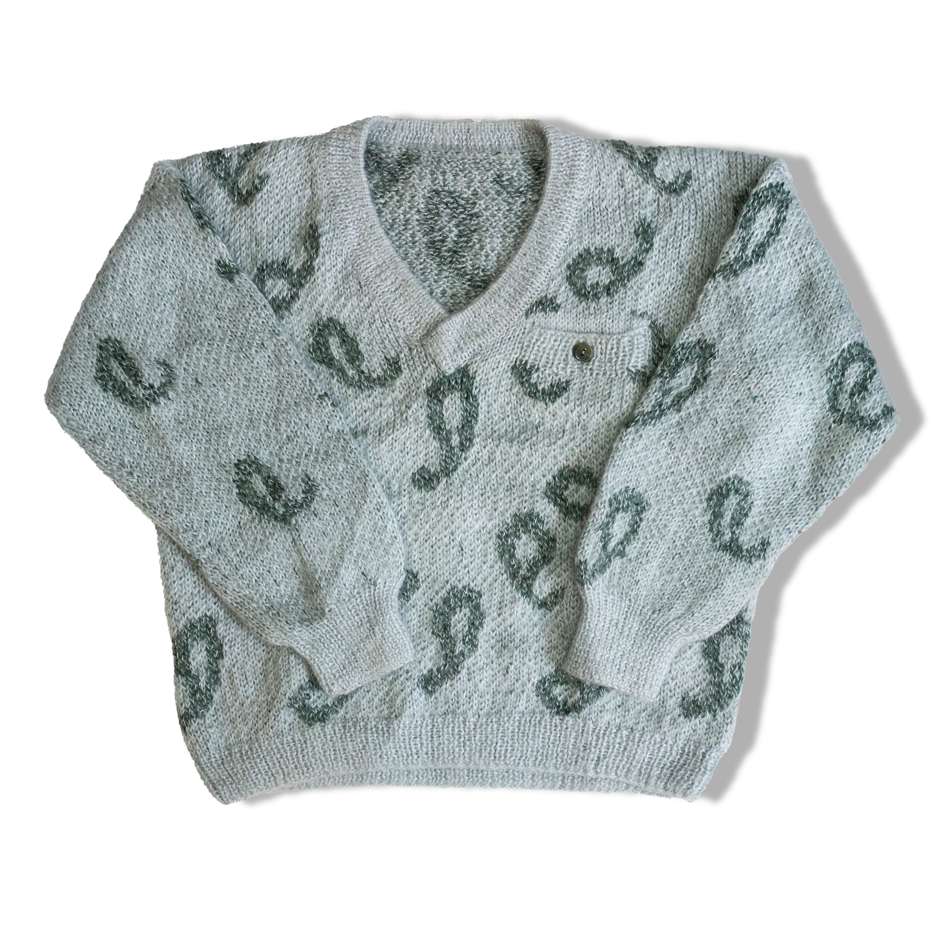 Super cute knit sweater with a little pocket