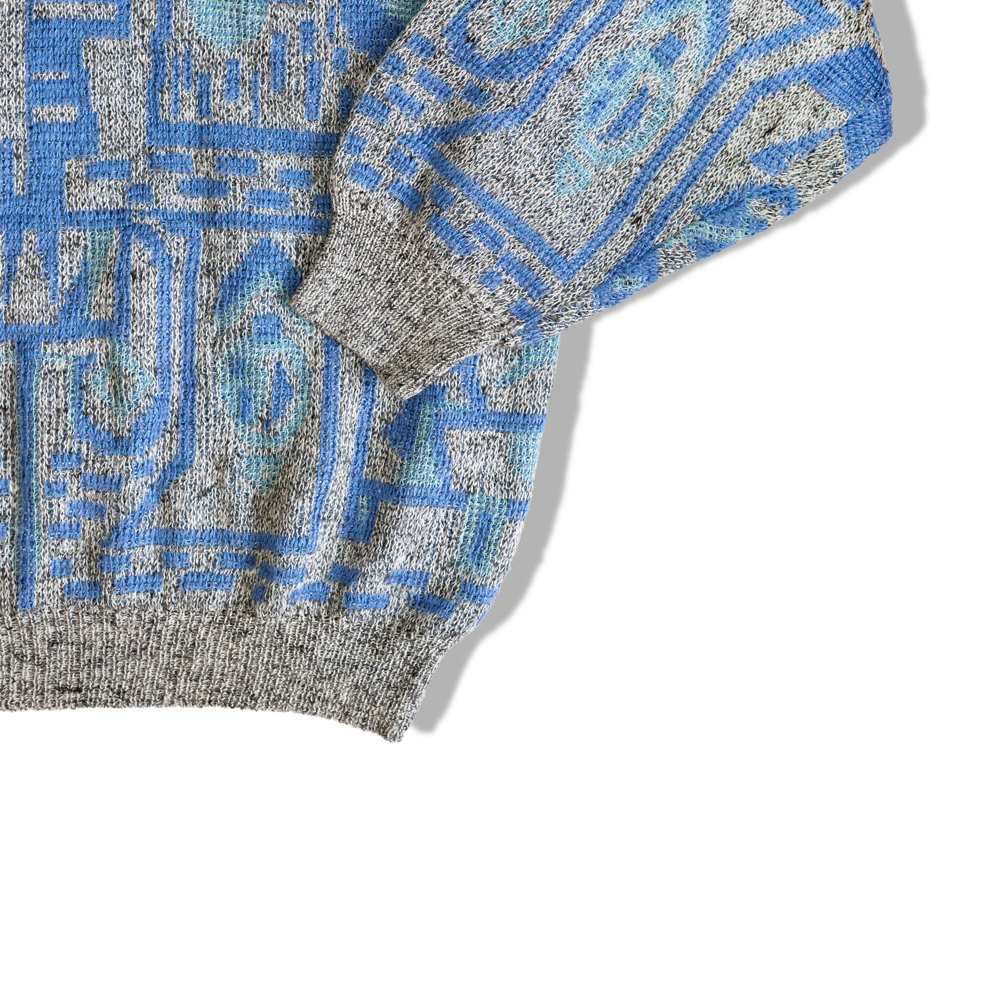 Beautiful grey knit sweater with blue geometric patterns