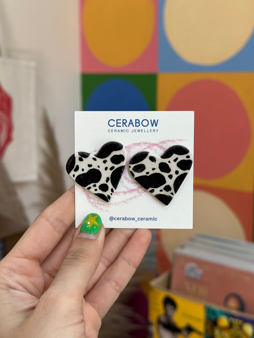 Cerabow handmade cow print heart earrings