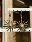 Gold toned brass sun earrings