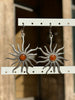 Silver toned brass sun earrings