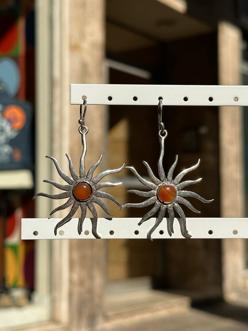 Silver toned brass sun earrings