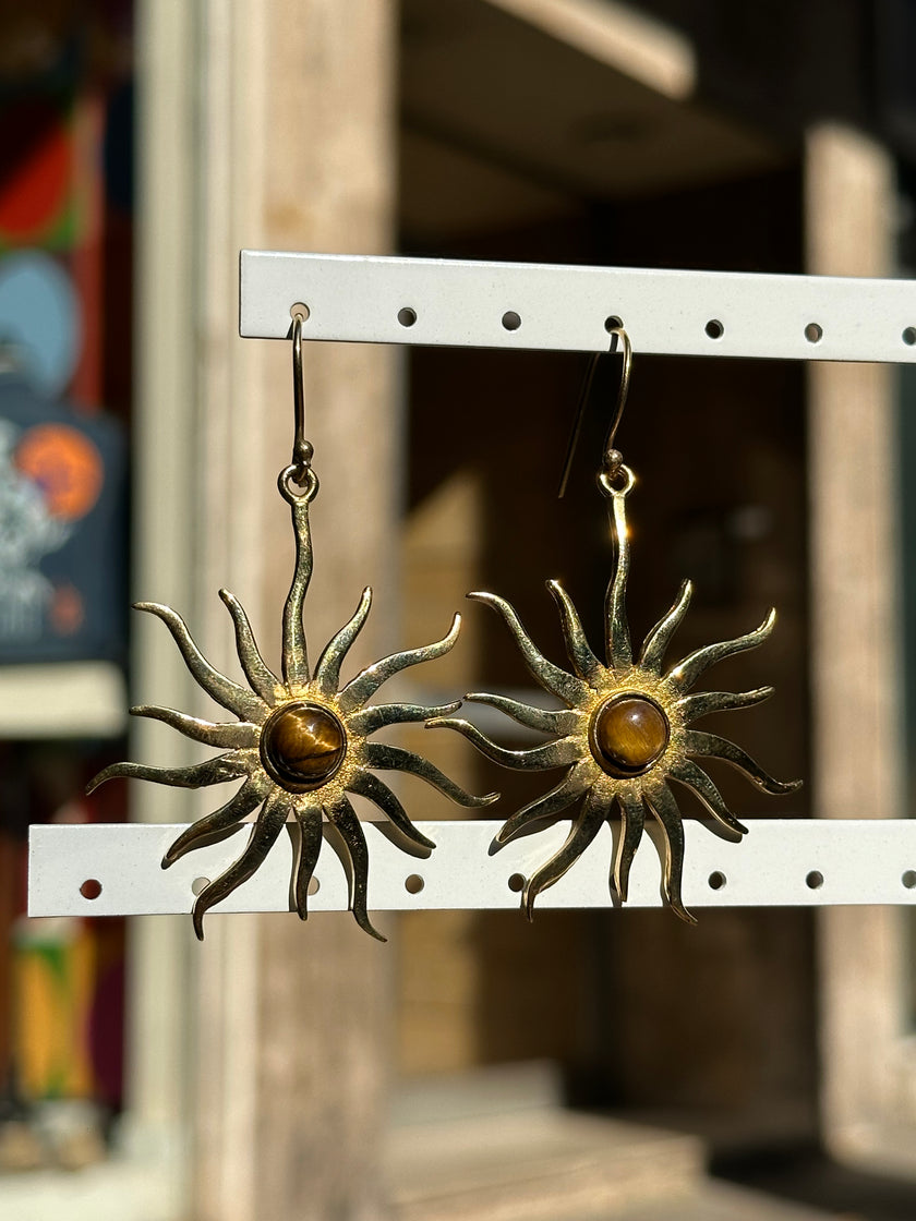 Gold toned brass sun earrings