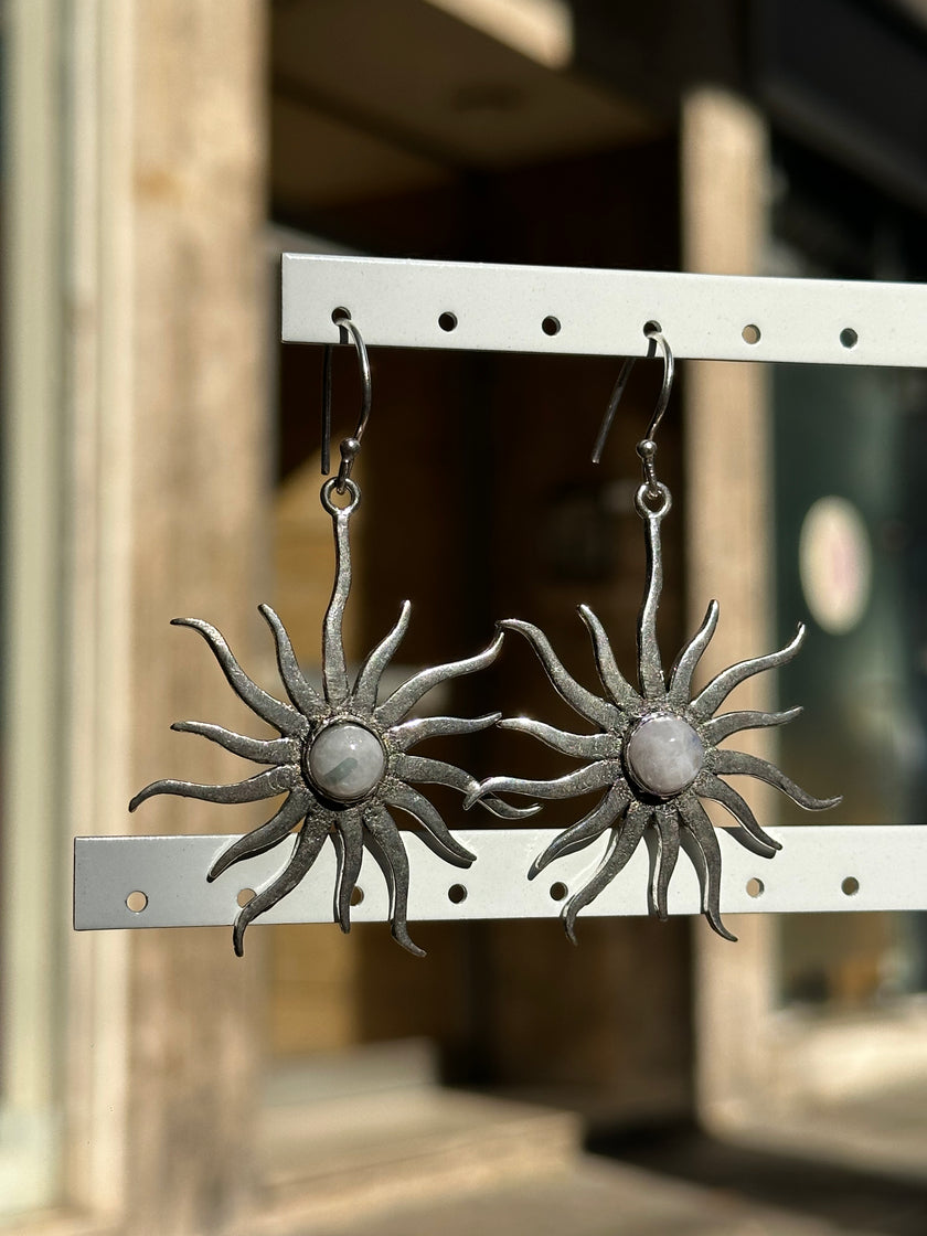 Silver toned brass sun earrings