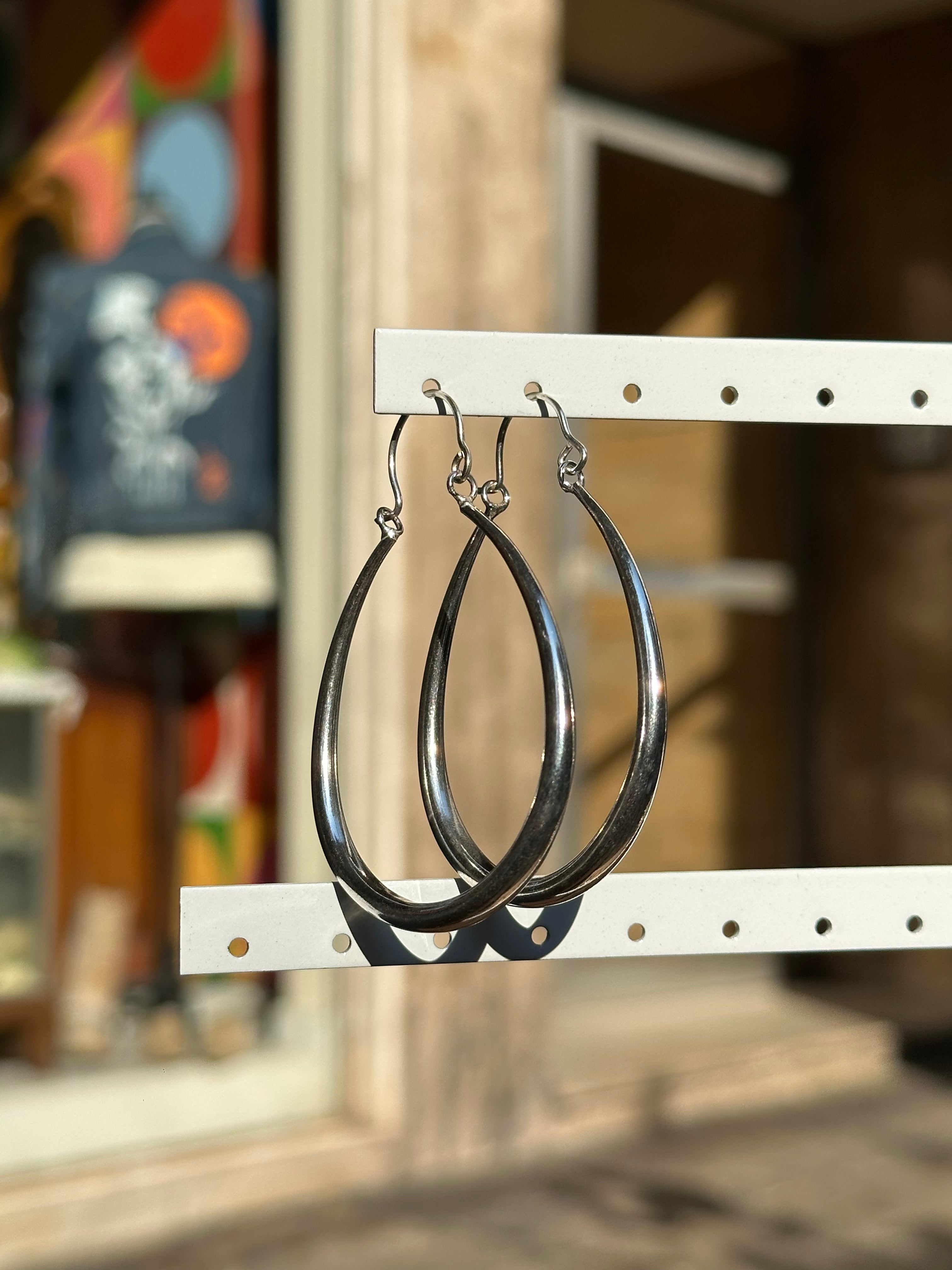 Silver toned brass hoop earrings
