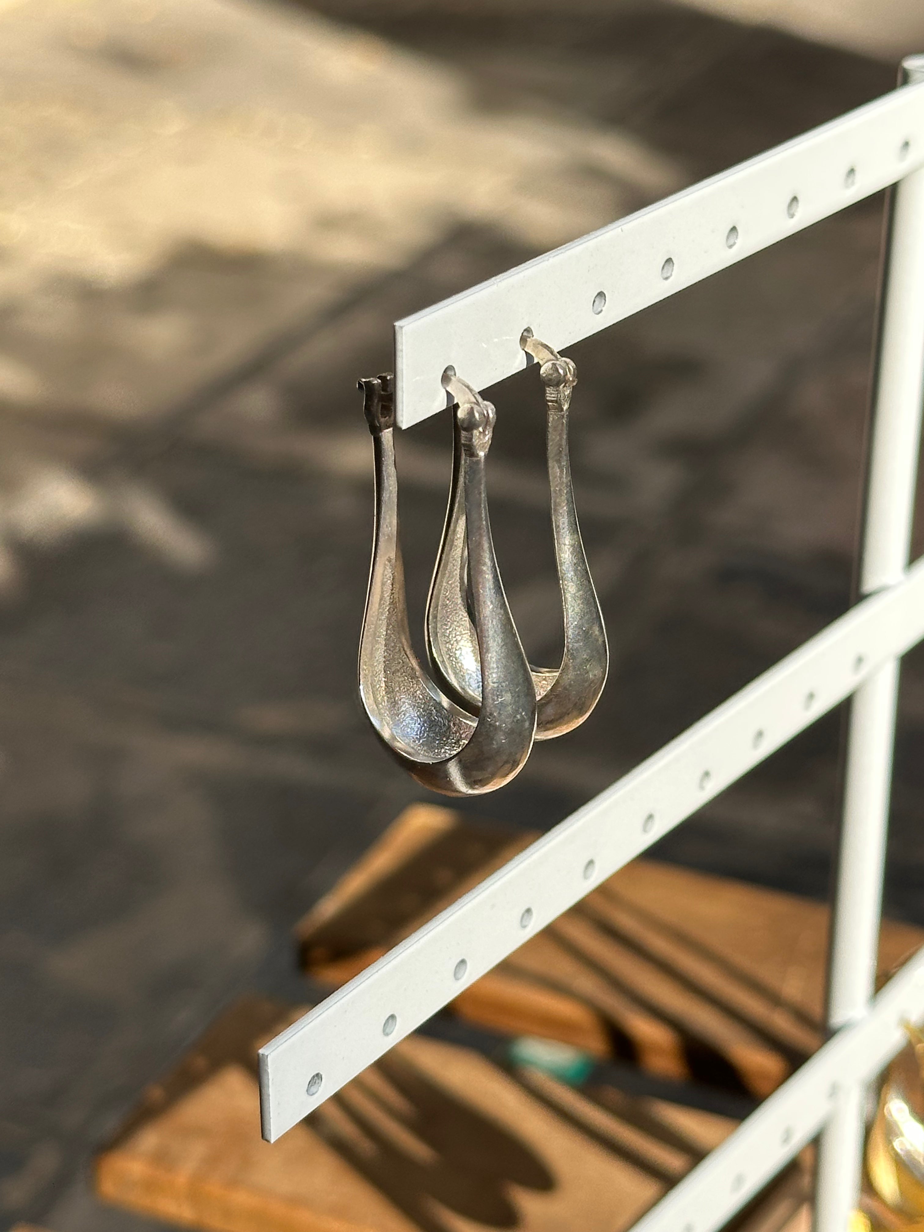 Silver toned brass earrings