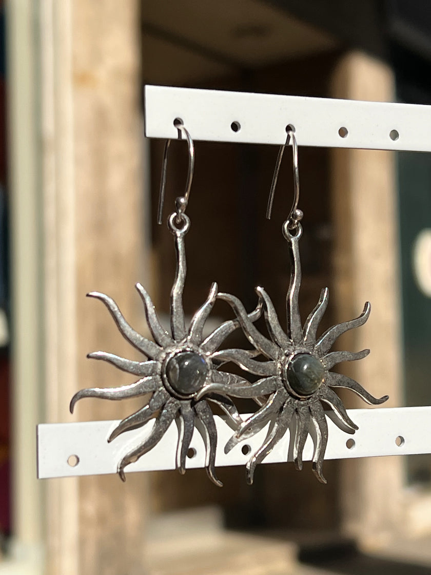 Silver toned brass sun earrings