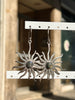 Silver toned brass sun earrings