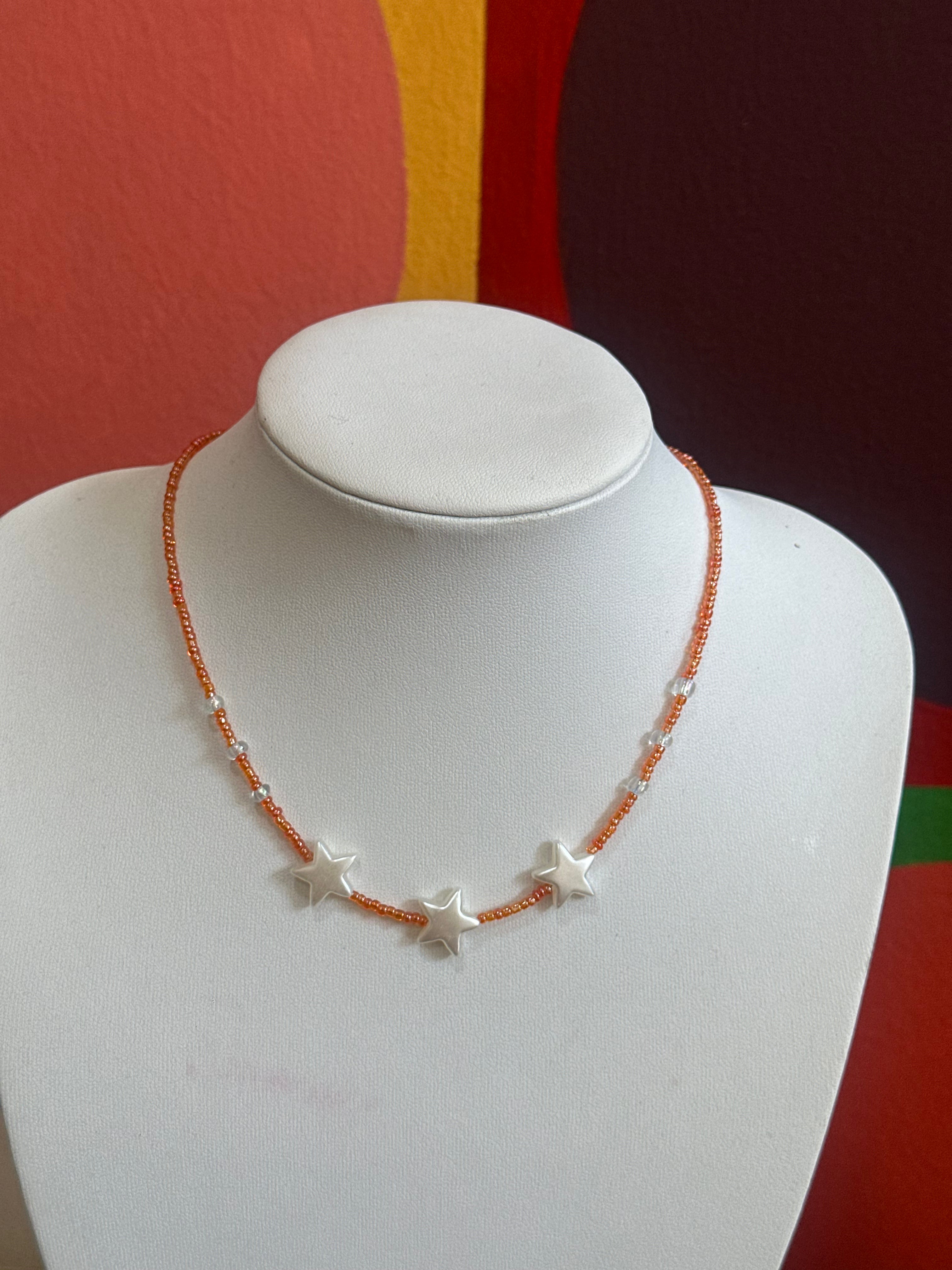 Handmade orange beaded necklace with stars