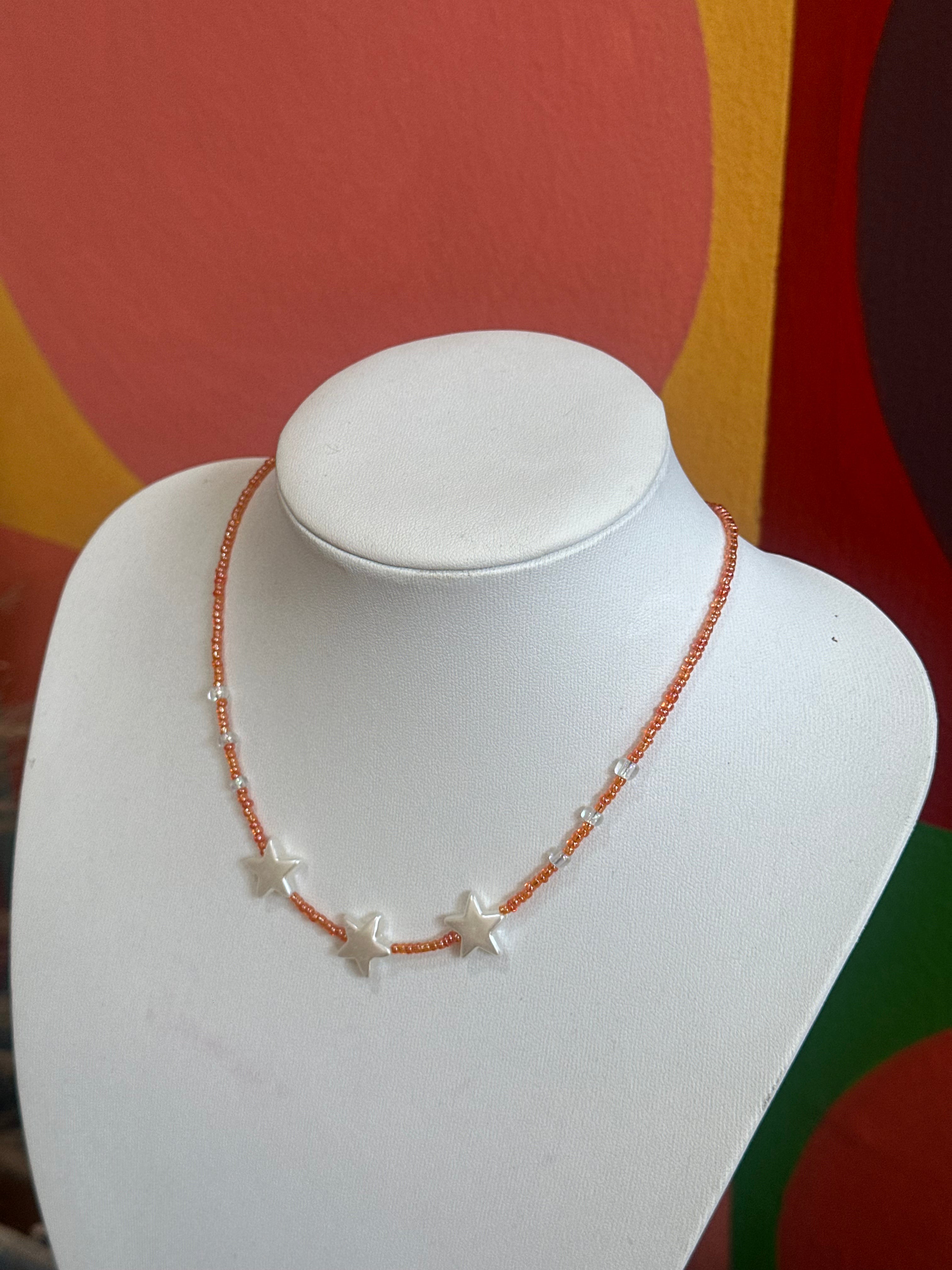 Handmade orange beaded necklace with stars