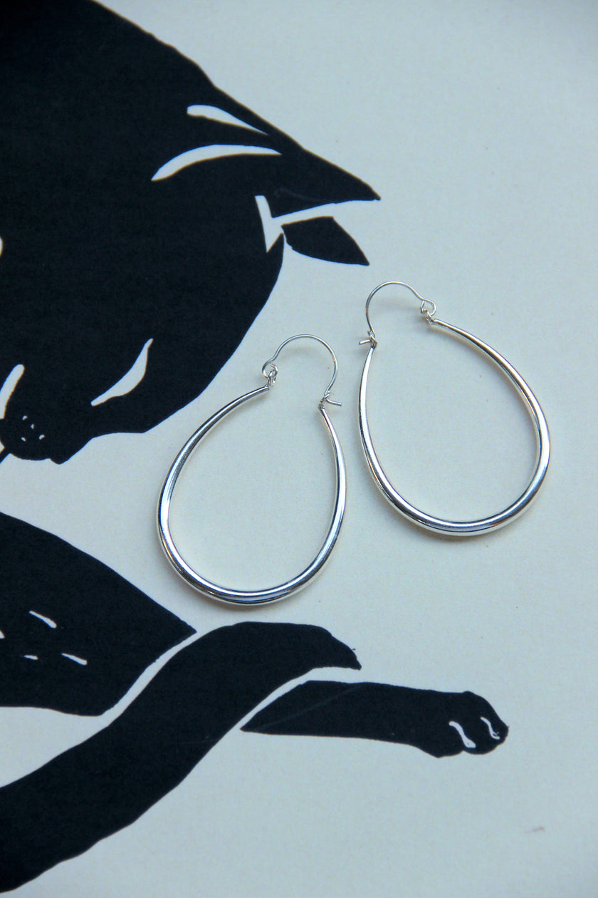 Silver toned brass hoop earrings
