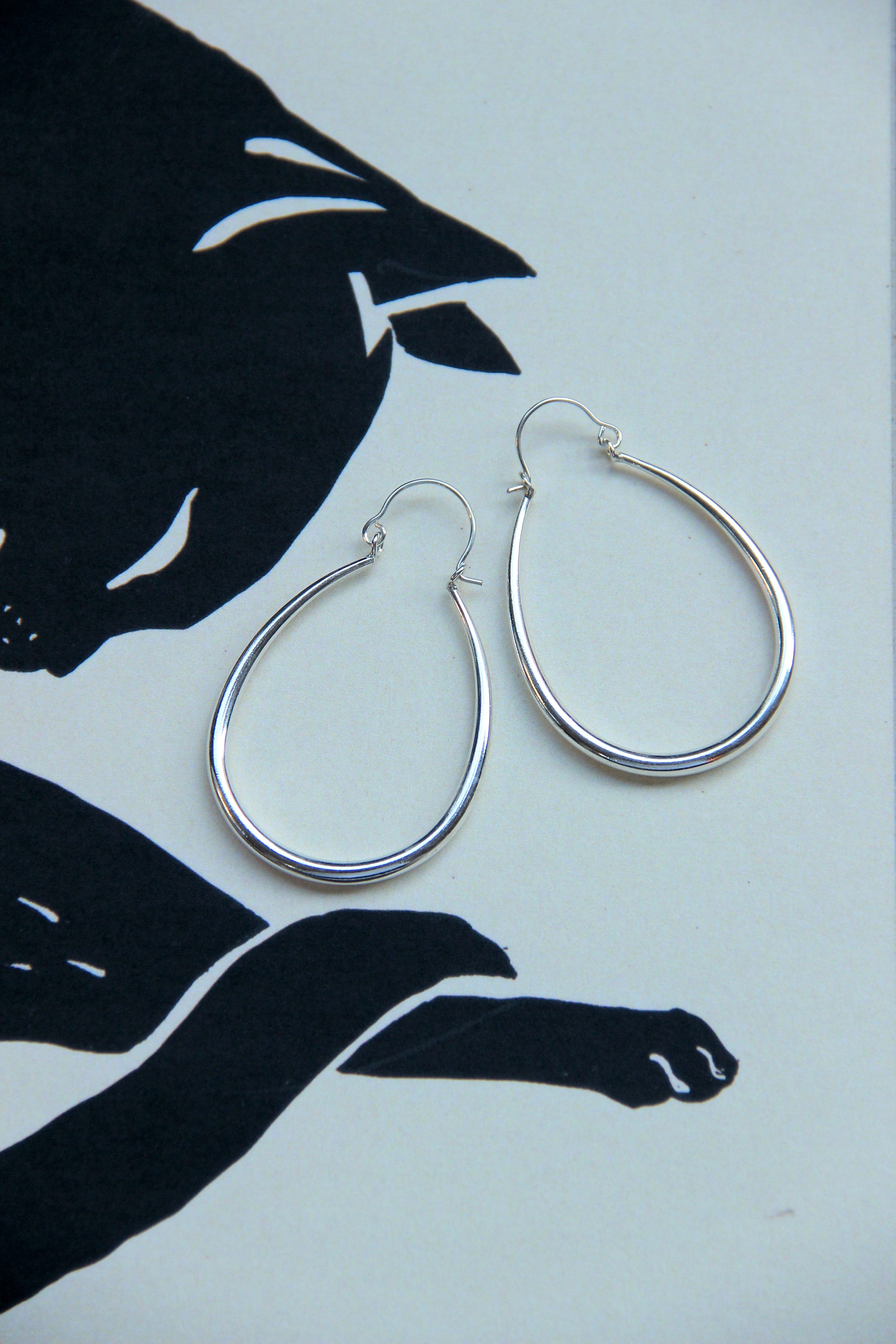 Silver toned brass hoop earrings