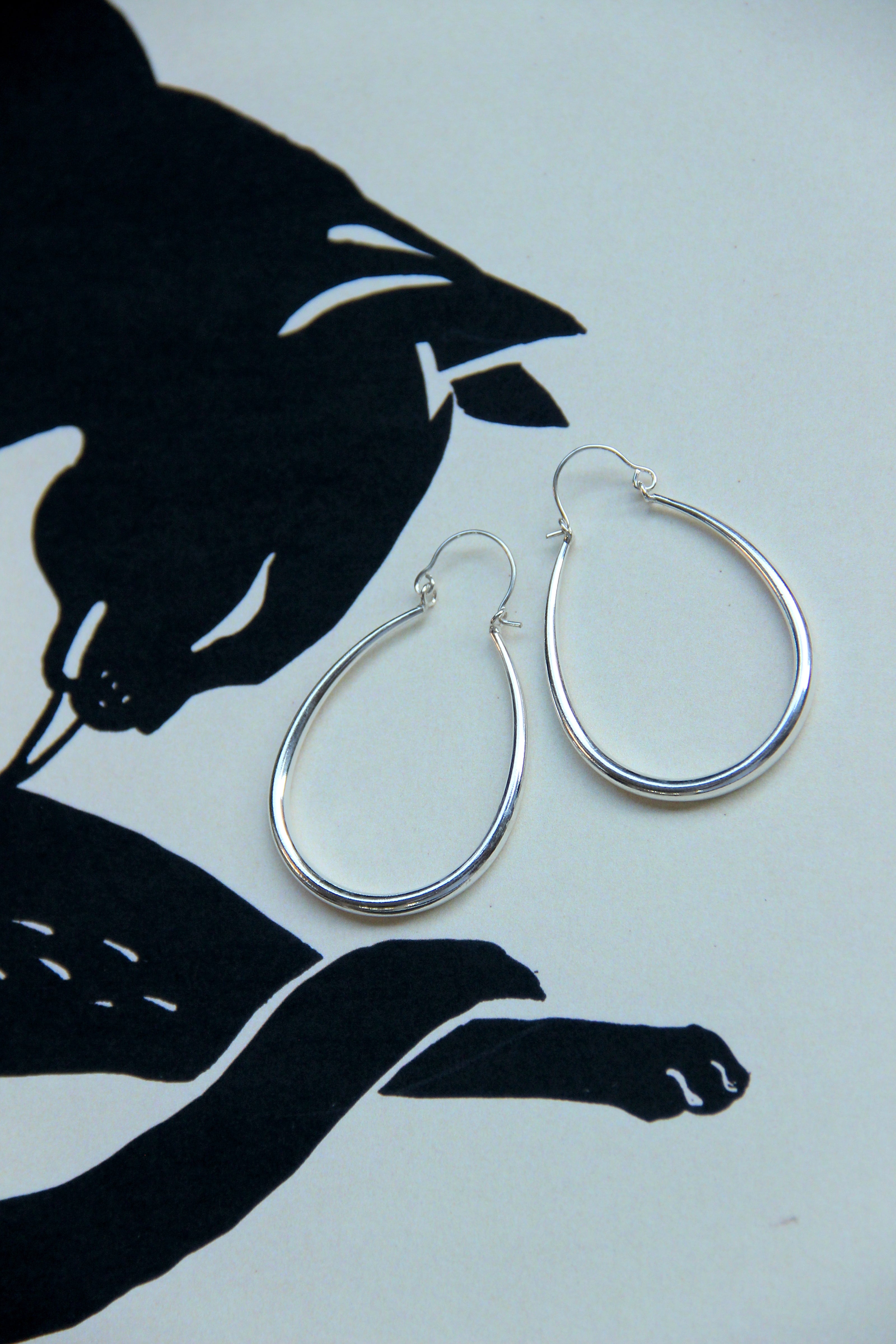 Silver toned brass hoop earrings