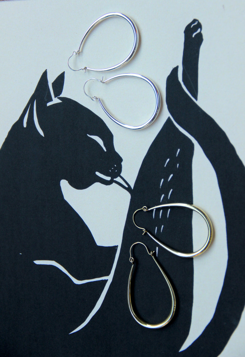 Silver toned brass hoop earrings