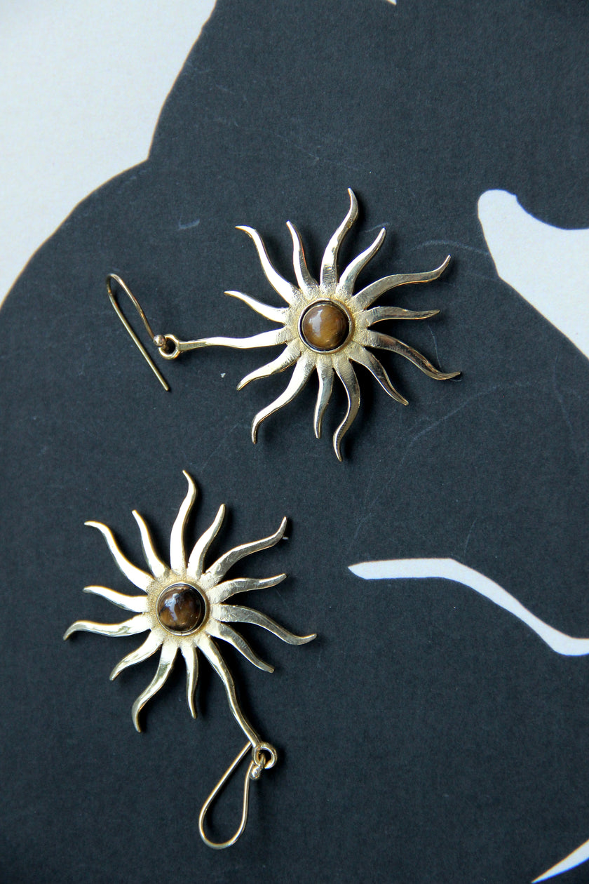 Gold toned brass sun earrings