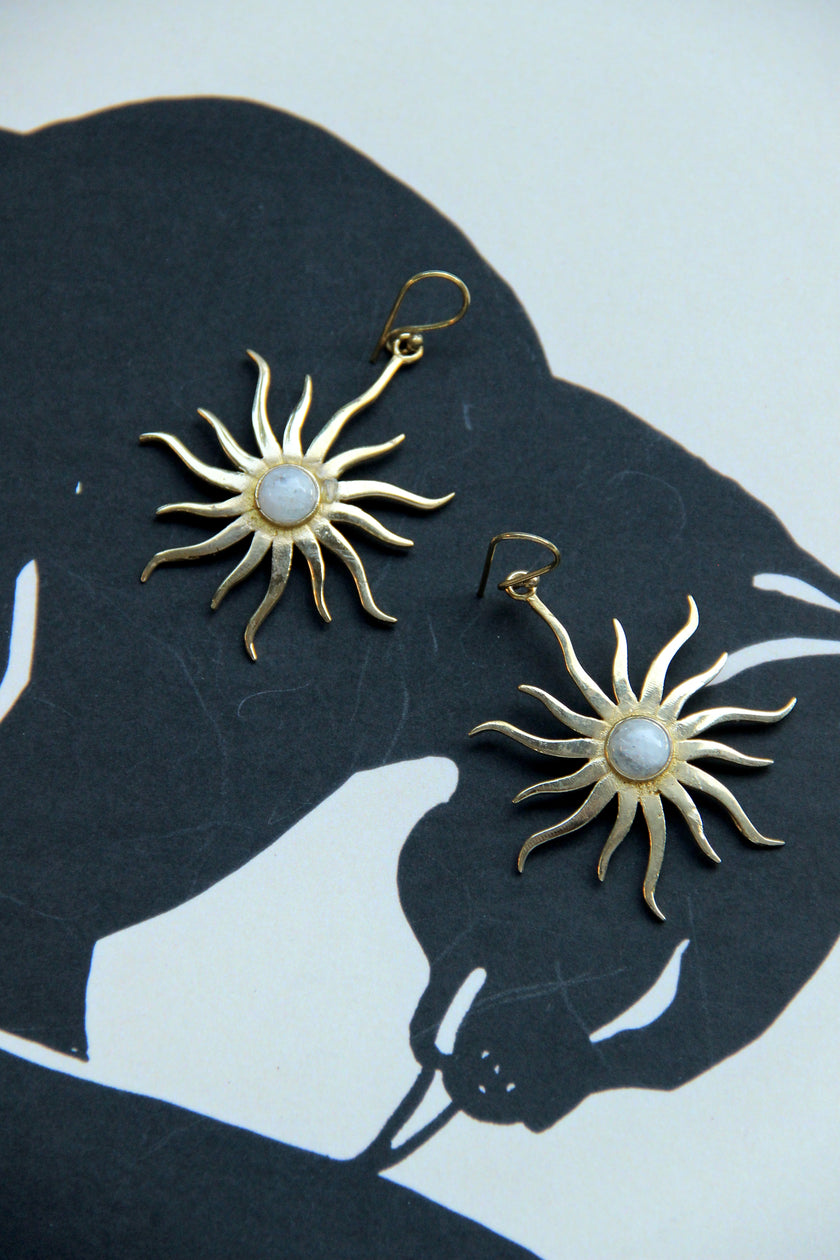 Gold toned brass sun earrings