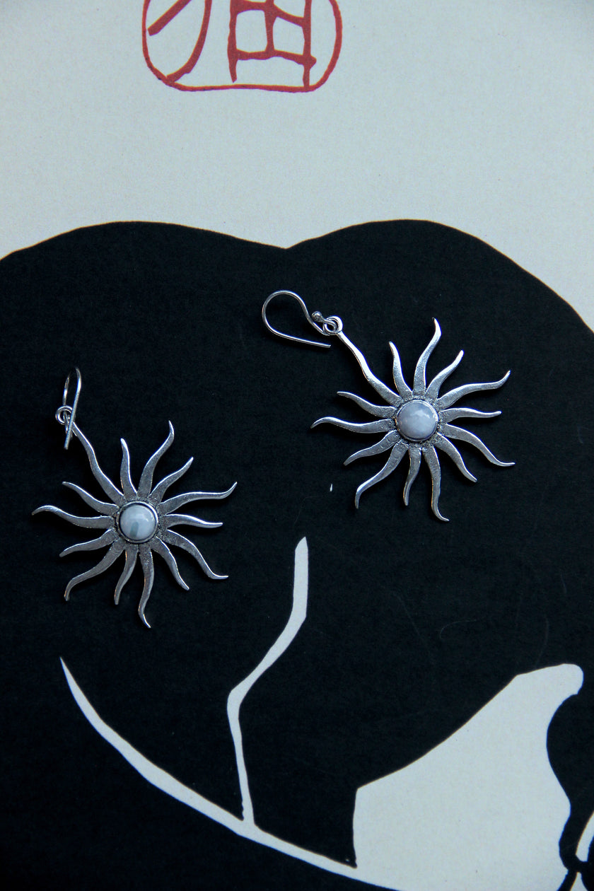 Silver toned brass sun earrings