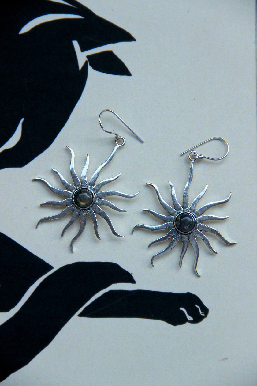Silver toned brass sun earrings