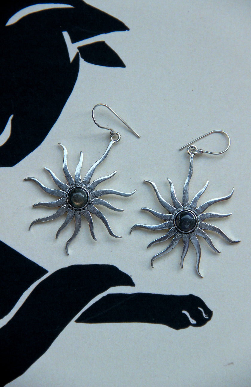 Silver toned brass sun earrings