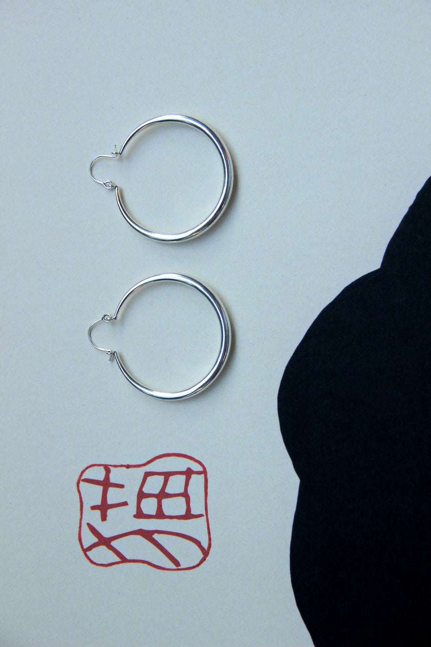 Silver toned brass hoop earrings