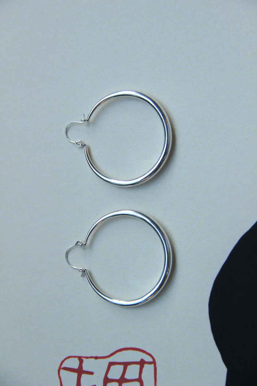 Silver toned brass hoop earrings