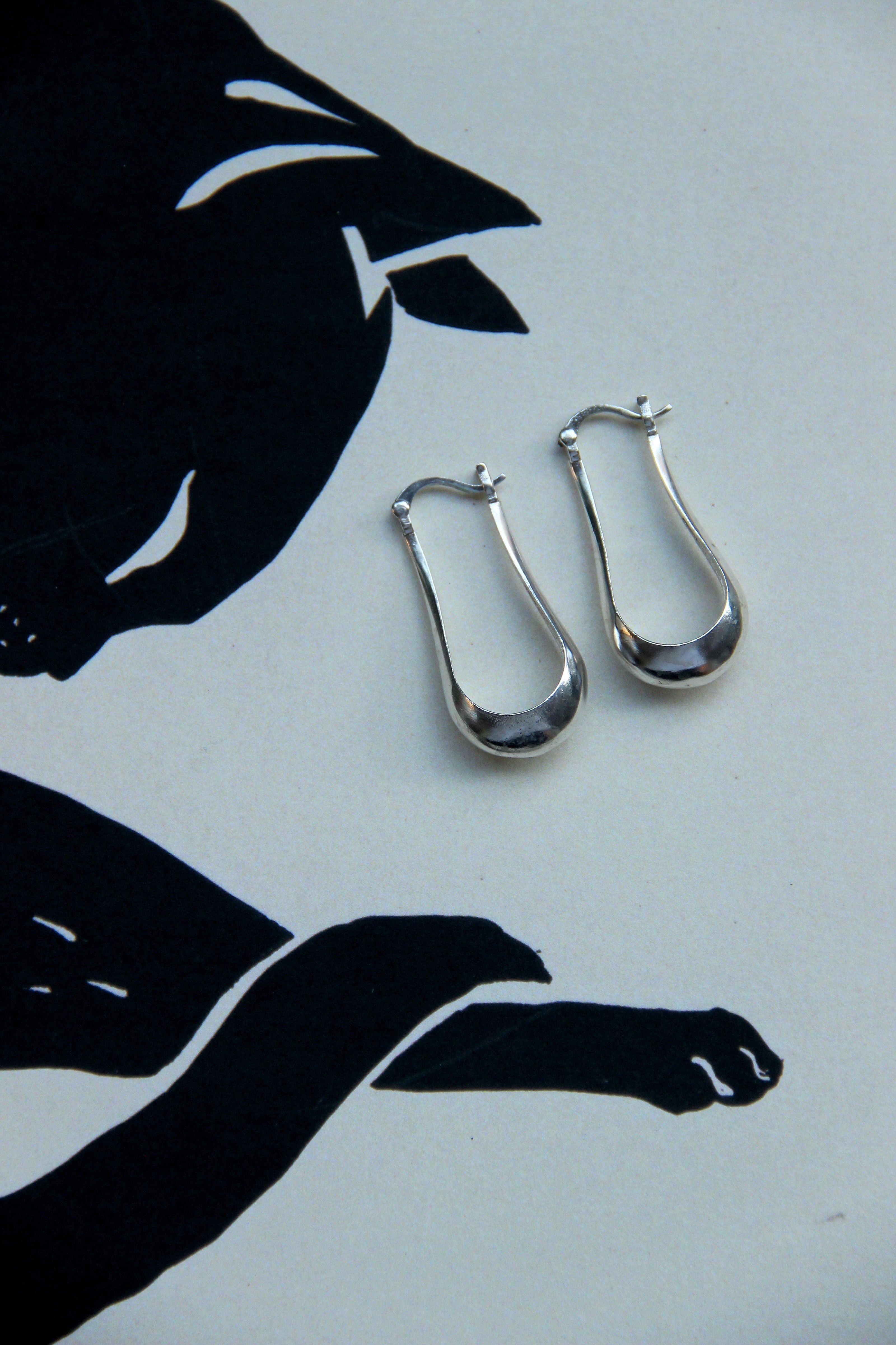Silver toned brass earrings