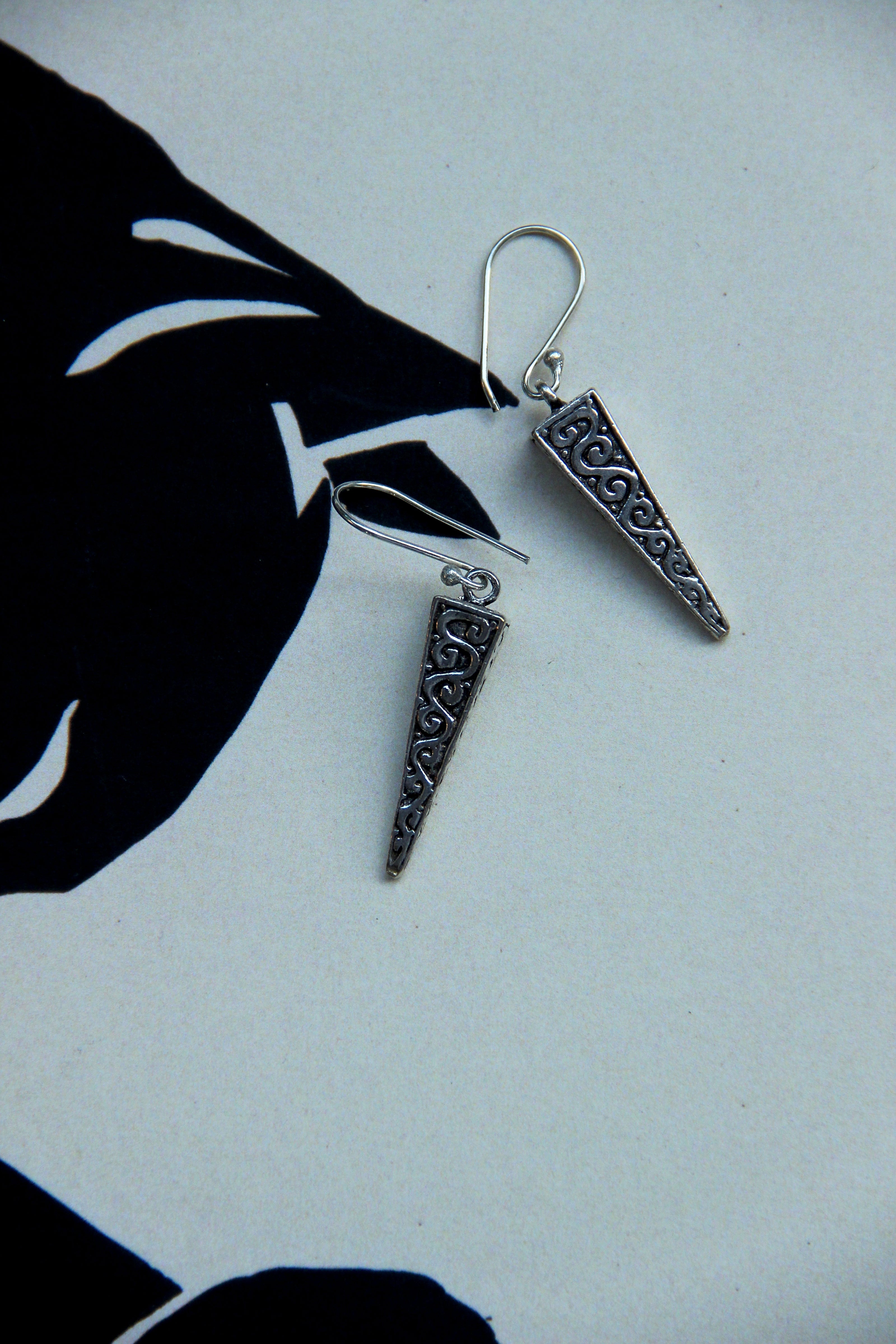 Silver toned brass earrings