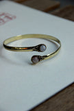 Stunning gold toned brass cuff bracelet (white stones)