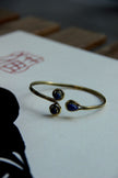 Stunning gold toned brass bracelet (blue stones)