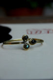 Stunning gold toned brass bracelet (grey stones)